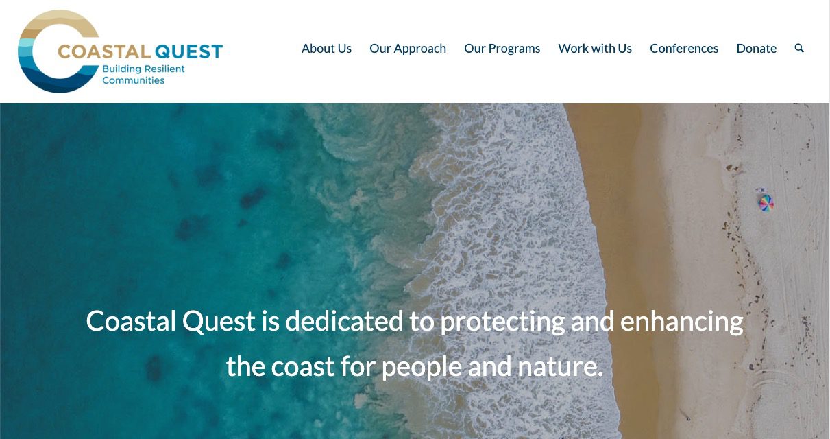 Aerial view of a sandy beach meeting turquoise ocean waves, with a small umbrella on the sand. Text reads: Coastal Quest is dedicated to protecting and enhancing the coast for people and nature.