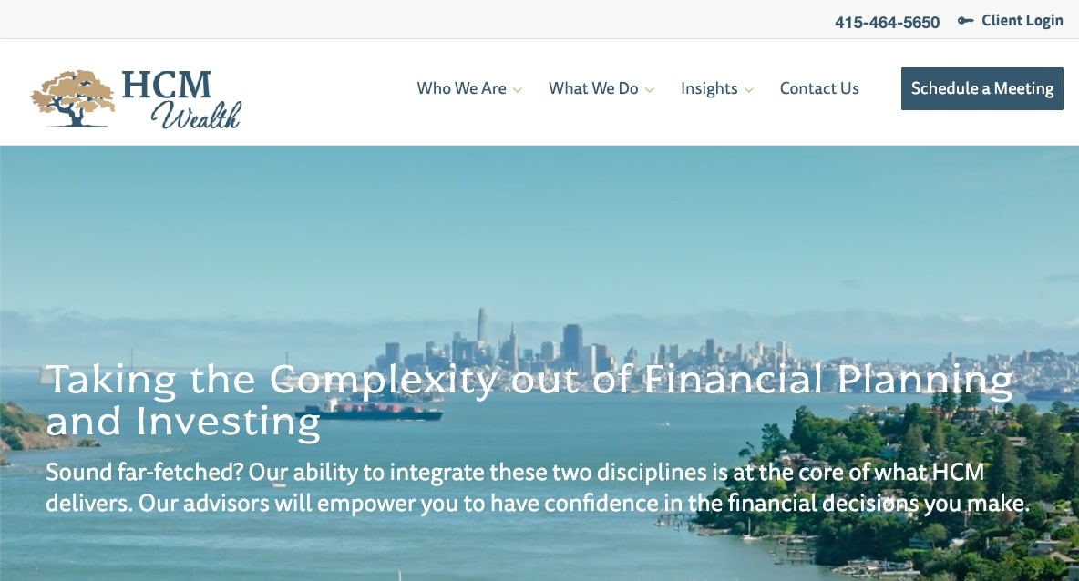 HCM Wealth website homepage with a city skyline and water in the background. Text reads: Taking the Complexity out of Financial Planning and Investing. Navigation and contact buttons are at the top.