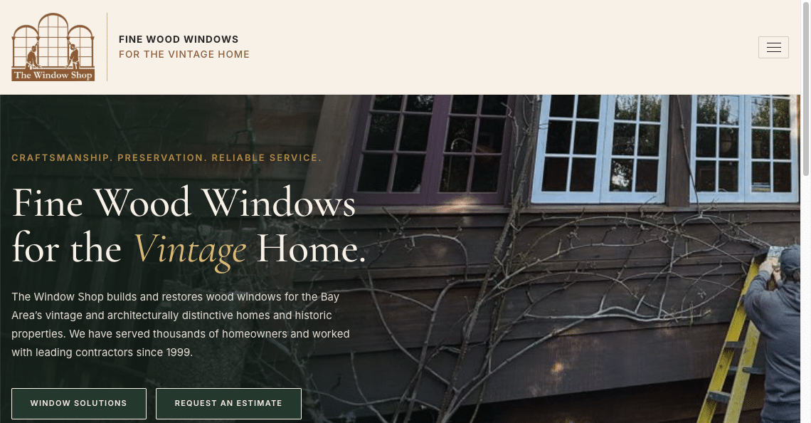 A person on a yellow ladder works on wood windows of a vintage home, with vines climbing the exterior. Text promotes fine wood windows and restoration services for historic Bay Area homes.